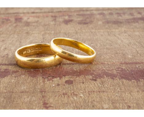 Two 22ct gold wedding bands, both in yellow gold D shaped, ring size O1/2 and P, 10g