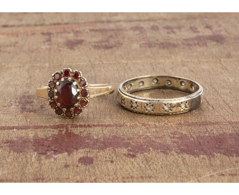 A garnet cluster ring, all in 9ct gold ring size N, and a gold band with paste stones Q1/2, 4.5g