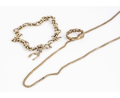 A collection of 9ct gold , including knot ring, a horse bit linked and horse shoe charm bracelet, and a fancy linked necklace