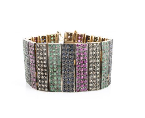 A diamond, ruby, sapphire and emerald panel linked bracelet, the twenty rectangular hinged panels pave set with circular cut 