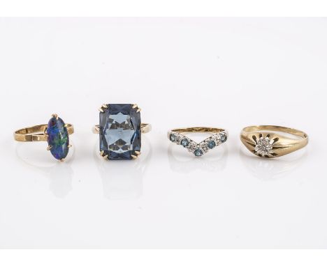 Four paste set dress rings,  comprising a blue paste example, an opal ring, an illusion set signet ring, and a topaz ring 11g