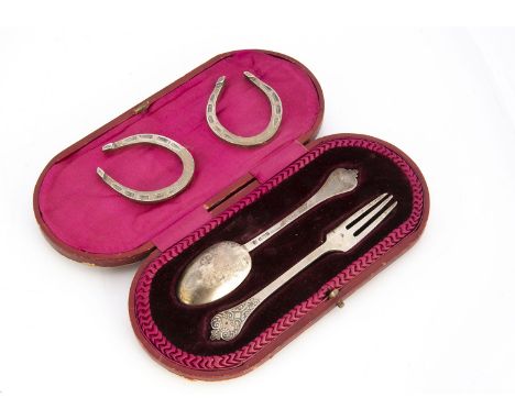 A cased Victorian silver Christening fork and spoon set, together with a modern pair of silver horseshoes (5)