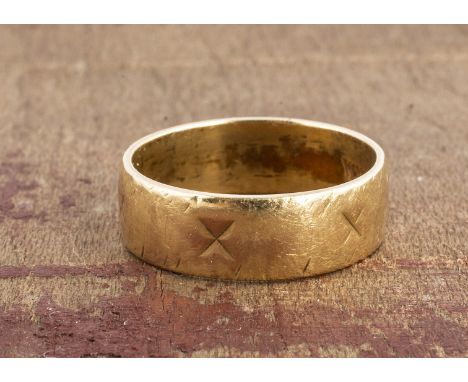 An 18ct gold wedding band, with engraved pattern, now worn, 5.9mm, ring size M, 4.7g 