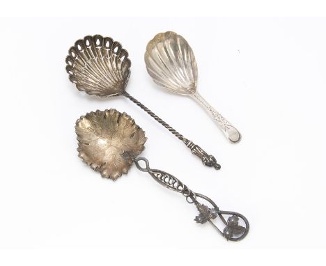 Three silver spoons, including a late Georgian tea caddy spoon, a Victorian vine leaf spoon by George Unite and an Edwardian 