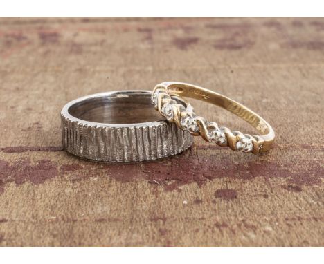 A 9ct white gold textured wedding band, flattened shape, 5.8mm, ring size P and a 9ct gold and diamond five stone eight cut r