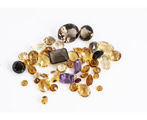 A collection of loose quartz gemstones, including citrine, smoky quartz, amethyst and others, 60ct
