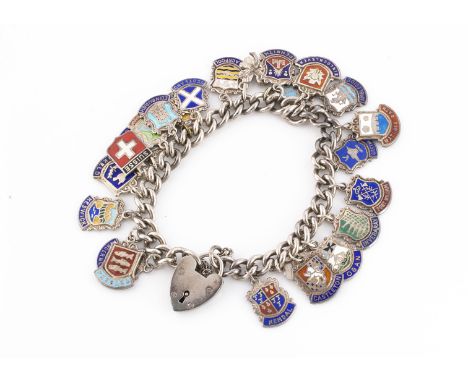 A silver and enamel charm/badge bracelet, the curb linked bracelet with heart shaped padlock clasp, with various shield shape