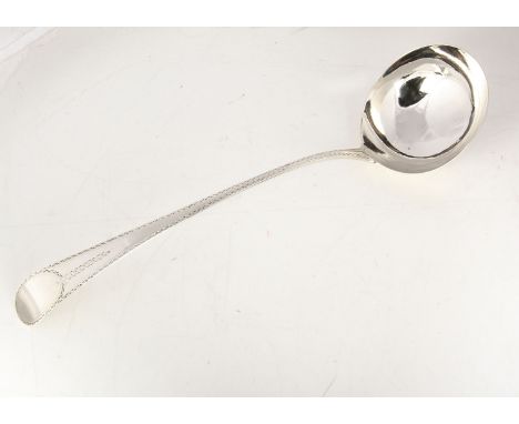 A Georgian silver soup ladle by GB, 32cm long and 4.79 ozt, English pattern with bright cut design