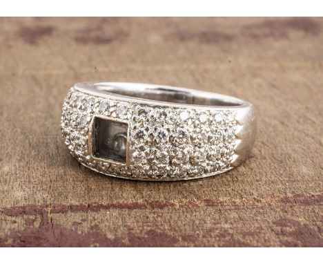 A continental white metal diamond set  'Vanli' marked  bombe ring, encrusted with brilliant cuts, with a central floating dia