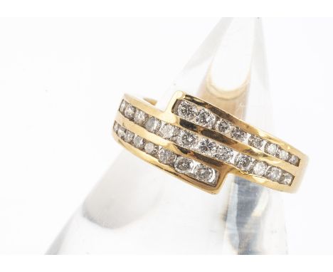 An 18ct gold three band brilliant cut diamond channel set ring,  the brilliant cuts triple set bands, hallmarked shank, ring 