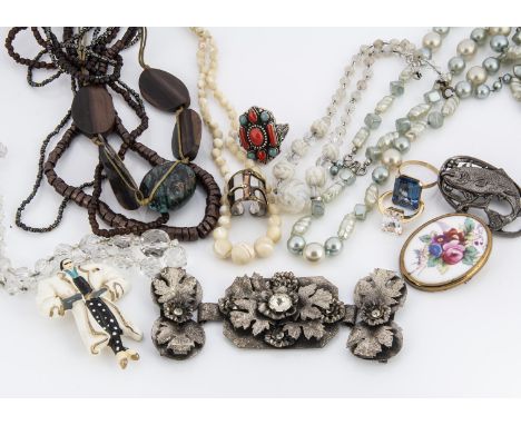 A collection of costume jewellery, including mother of pearl necklace, opalescent glass beads, base metal and paste set buckl