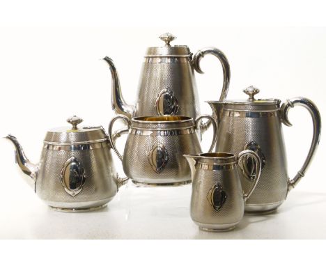 Elkington & Co. silver plated tea set to include milk jug, tea pot, coffee pot, hot water jug and bowl, engine turned decorat