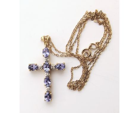 9ct gold and tanzanite cross We are unable to provide condition reports for this sale.