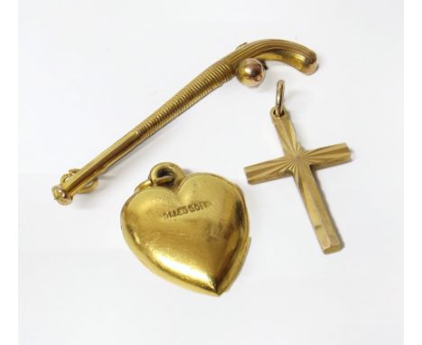 Gold heart pendant and gold cross pendant and a hockey stick pendant 9ct We are unable to provide condition reports for this 