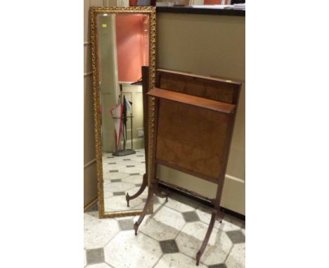 Gold painted wall hanging dressing mirror and a mahogany framed fire screen. We are unable to provide condition reports for t