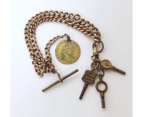 9ct gold chain and brass charms. We are unable to provide condition reports for this sale.