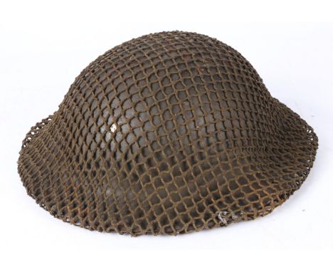 Second World War British MK II Steel Helmet, complete with liner, chin strap and camouflage helmet net, two holes drilled eac