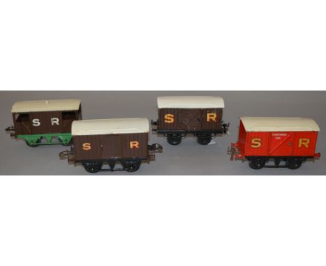 O Gauge. Hornby 4 x SR rolling stock, including scarce gunpowder van, brake van & luggage vans. Overall F/G repainted roof to