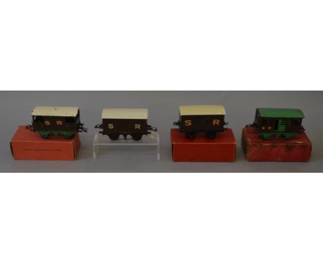 O Gauge Hornby 4 x rolling stock. SR cattle truck green/brown, SR brake van brown with gold letters, SR goods van brown, gold