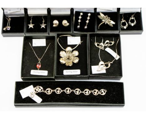 A collection of sterling silver jewellery, bracelet, pendants, earrings, brooches, many with 'jewelled' decoration (11) 