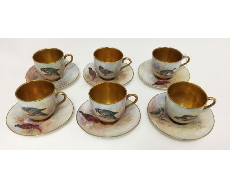  A set of six Royal Worcester coffee cans and saucers, all signed Telford, wild birds, gilt interiors  