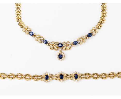  A sapphire and diamond cluster necklace and bracelet ensuite,  18ct gold, the bracelet comprising three oval clusters, the t