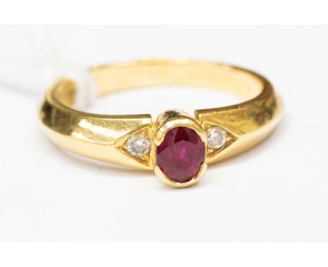 An 18ct gold, ruby and diamond ring, rub over set oval ruby approx 4mm x 3.5mm, with diamond set shoulders,  size N, total gr