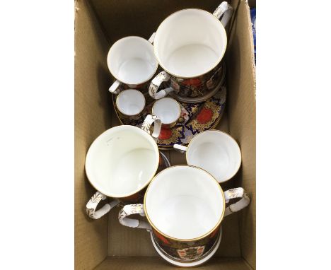 Three Derby ceramic studio plates together with three large loving cups, a small loving cup, a mug and two egg cups, all Hami