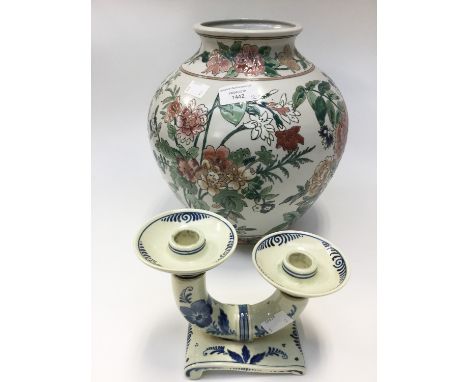 An Oriental vase together with a Delft ware twin candlestick (2) 