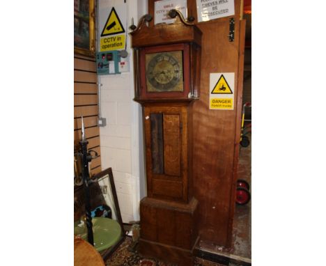 An oak longcase clock with brass dial by William Wilkes-Wolverton