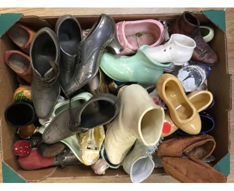 A collection of miniature shoes to include metal pin cushion, shoes and ceramic shoes (one box) 