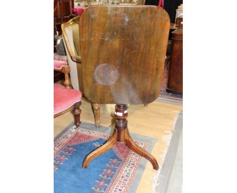  A 19th Century mahogany tilt top tripod table, raised on a turned column, three legs 