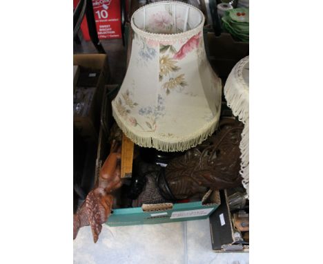 An Oriental hardwood carved table lamp; together with two wooden carved figures, a wooden whistle and a wood measuring stick 