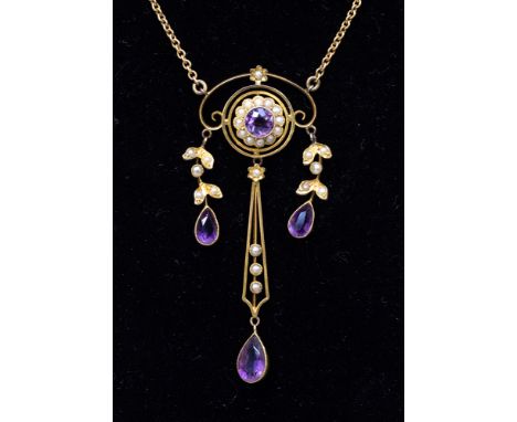 An Edwardian 9ct gold amethyst and pearl pendant, open work, with centrally set amethyst with pearl surround, with suspended 