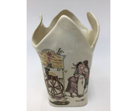 A Sarreguemines, circa 1910 vase with children and games motifs, a cupid emblem, approx 18cms high