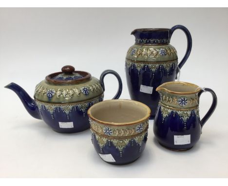 A Royal Doulton four piece tea service, blue ground and sprigged decoration, comprising teapot, water jug, milk and sugar (4)