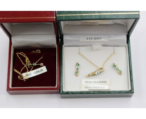 A 9ct gold and emerald pendant and matching earrings and a 9ct gold chain with baton set ruby, sapphire and emerald pendant (