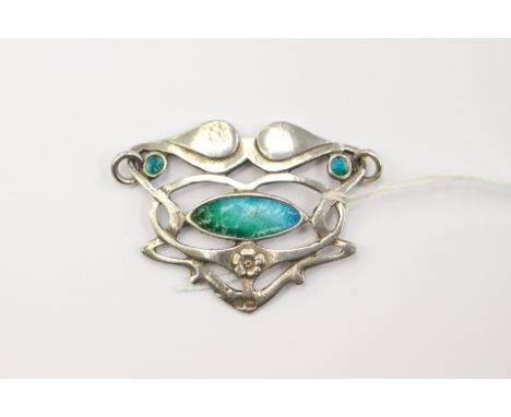 A silver and enamelled Art Nouveau pendant detail, Chester 1904, with sinuous swirls and turquoise enamel accents, approx siz