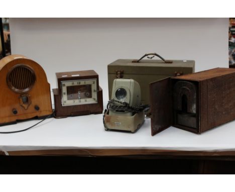 A collectors lot including an Art Deco Westminster silent chime mantel clock, 1950s radio and two slide projectors in fitted 