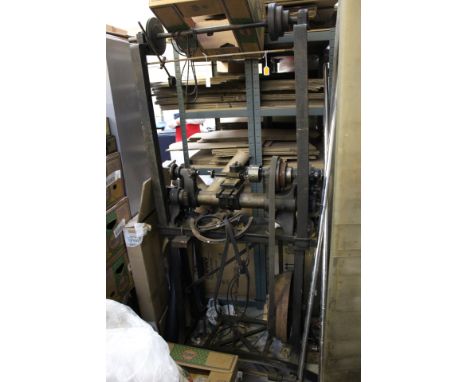 A Drummond Brothers cast iron four inch treadle laithe, with a three jaw chuck, circa 1910, together with two boxes of associ
