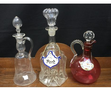 Victorian ruby glass claret jug, William IV decanter and Arts and Crafts claret jug (3) 