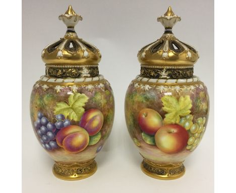  A pair of Royal Worcester fruit painted pot pourri vases and covers, ref: 2048, both including internal cover, both signed F