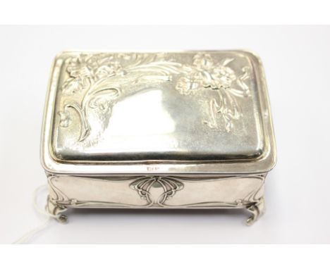 A silver jewellery box, embossed in Art Nouveau design, Birmingham 1904, approx dimensions 111mm x 185mm x 40mm inc feet, wei