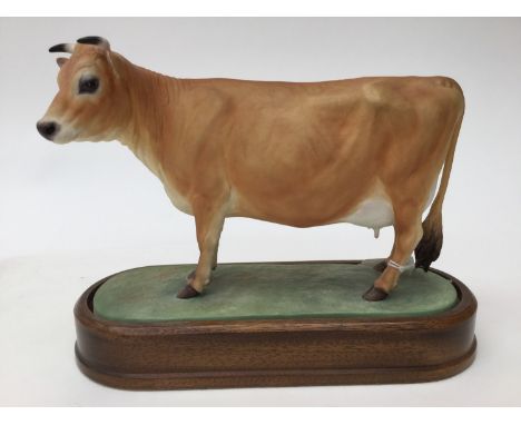 A Royal Worcester limited edition 474/500 Jersey Cow, designed by and signed by Doris Lindner with plinth, FRAMED CERTIFICATE