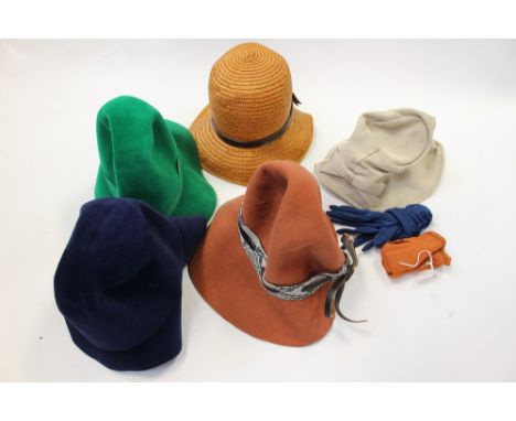 A collection of 1950/60s hats, one eau-de-nil grograin 1950s plant pot design, straw/felt hats in navy and jade and a tan fel