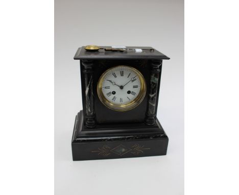 Black marble mantle clock with etched detailing, eight days, Roman numerals, key and pendulum