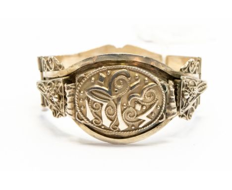 A French silver bangle with ornate detail, swirls rope design, total gross weight approx 34gms