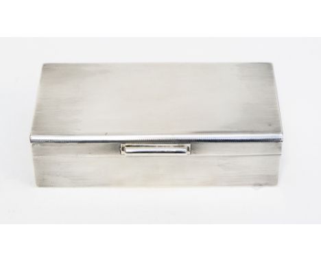 A silver cigarette box, cedar lined engine turned, London 1940
