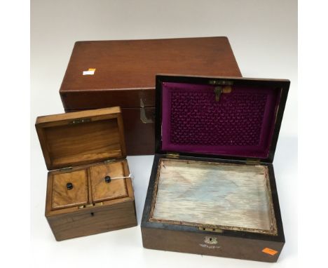 A large mahogany box; together with a walnut jewellery box with mother of pearl cartouche and scroll to lid and a tea caddy (