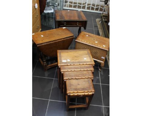 A collection of furniture, comprising a nest of four table, an Anglo Indian sewing box, an oak joined drop leaf coffee table,